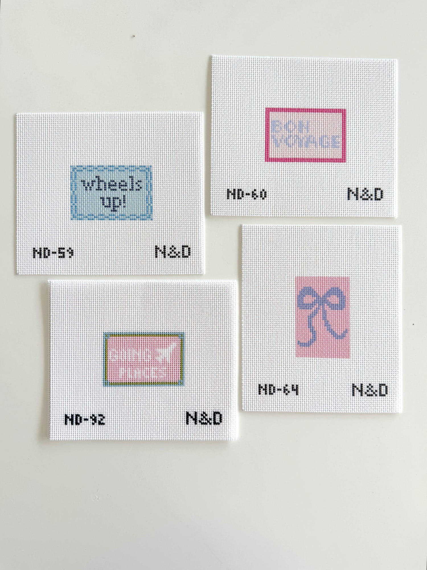Four N&D needlepoint canvases 